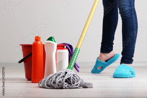 Photo: Cleaning floor in room close-up Cleaning floor in room close-up