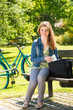 Teenager student girl sitting on bench