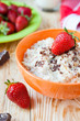 Photo: cereal with milk and ripe strawberries cereal with milk and ripe strawberries