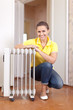  Happy woman near oil heater