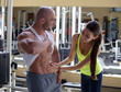 woman checks abdominal muscles athlete