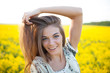 Girl with long hair of yellow wildflowers
