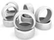 Stack of wheel tires on white.
