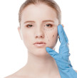 Beautician draw correction lines on woman face