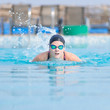 Young girl swimming butterfly stroke style