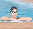 Female swimmer in blue water swimming pool. Sport woman.