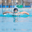 Young girl swimming butterfly stroke style