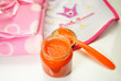 Orange Baby Food with a Pink and White Bib