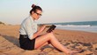 Video: Businesswoman working on tablet computer on the beach Businesswoman working on tablet computer on the beach