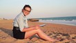 Video: Happy businesswoman with tablet computer on the beach Happy businesswoman with tablet computer on the beach