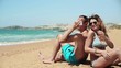 Video: Young happy couple talking on cellphone on the beach Young happy couple talking on cellphone on the beach