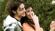 Couple laughing and smiling in park