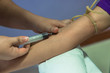 blood sample extracted from a vein in the arm using a needle