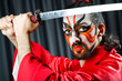 Man with sword and face mask