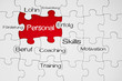 Puzzle in Rot mit Personal