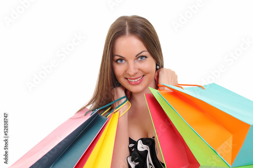 Photo: Portrait of young woman with shopping bags Portrait of young woman with shopping bags