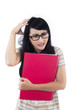 Stressful female student on white background