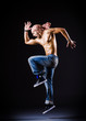 Dancer dancing in the dark studio
