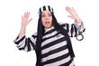 Prisoner in striped uniform on white
