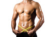 Muscular man measuring his muscles