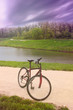 Mountaine bike on countryside road with dramatic sky background