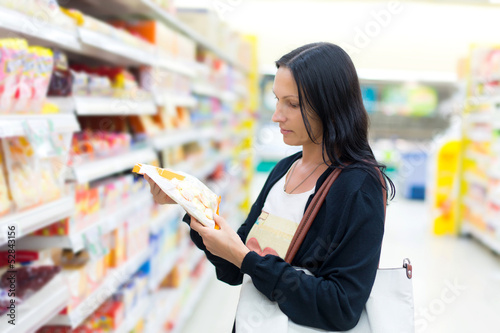 Photo: A woman buys sweets A woman buys sweets