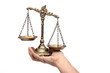 Holding Decorative Scales of Justice