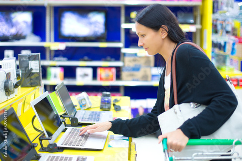 Photo: woman buying a laptop woman buying a laptop