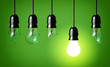 idea concept with broken bulbs and  one glowing bulb