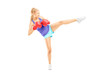 Female with boxing gloves hitting with her leg