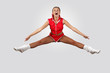 Young female dancer against white background