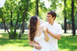 Young love Couple smiling under blue sky