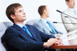 Photo: Three businesspeople at meeting Three businesspeople at meeting