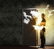 Young businessman opening door