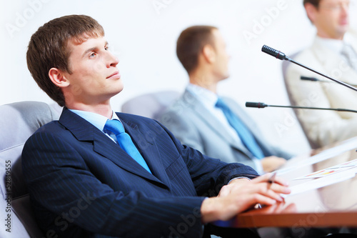 Photo: Three businesspeople at meeting Three businesspeople at meeting