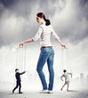 Businesswoman puppeteer