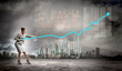 Photo: Businesswoman pulling graphic Businesswoman pulling graphic