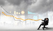 Businessman pulling graph