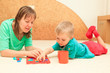 little boy learning shapes with mother