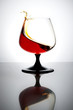 Splash of cognac in glass