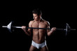 Portrait of handsome sportsman lifting weights