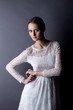 Photo: Portrait of fragile young girl in white lace dress Portrait of fragile young girl in white lace dress