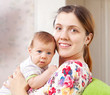 Portrait of happy mother with her baby