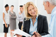 Business People Discussing Tog...