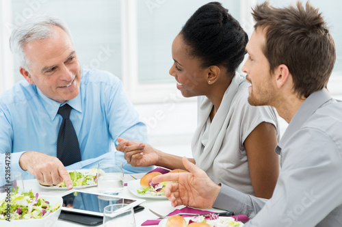 Photo: Discussing of Work at Lunch Discussing of Work at Lunch