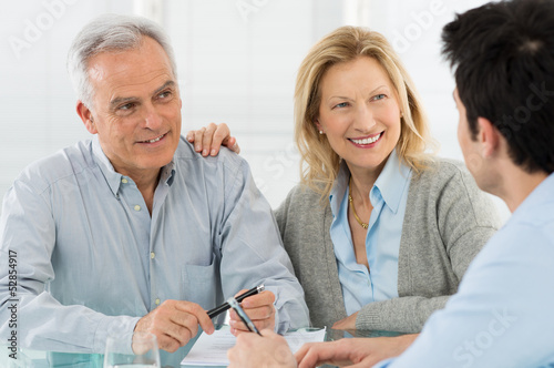 Photo: Senior Couple Talking With A Consultant Senior Couple Talking With A Consultant