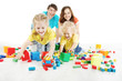 Photo: Happy family. Parents with two kids playing blocks toys Happy family. Parents with two kids playing blocks toys