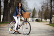 Urban biking - middle-age woman and bike in city