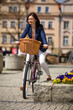 Urban biking - middle-age woman and bike in city