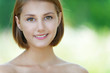 Photo: smiling beautiful young woman close up smiling beautiful young woman close up